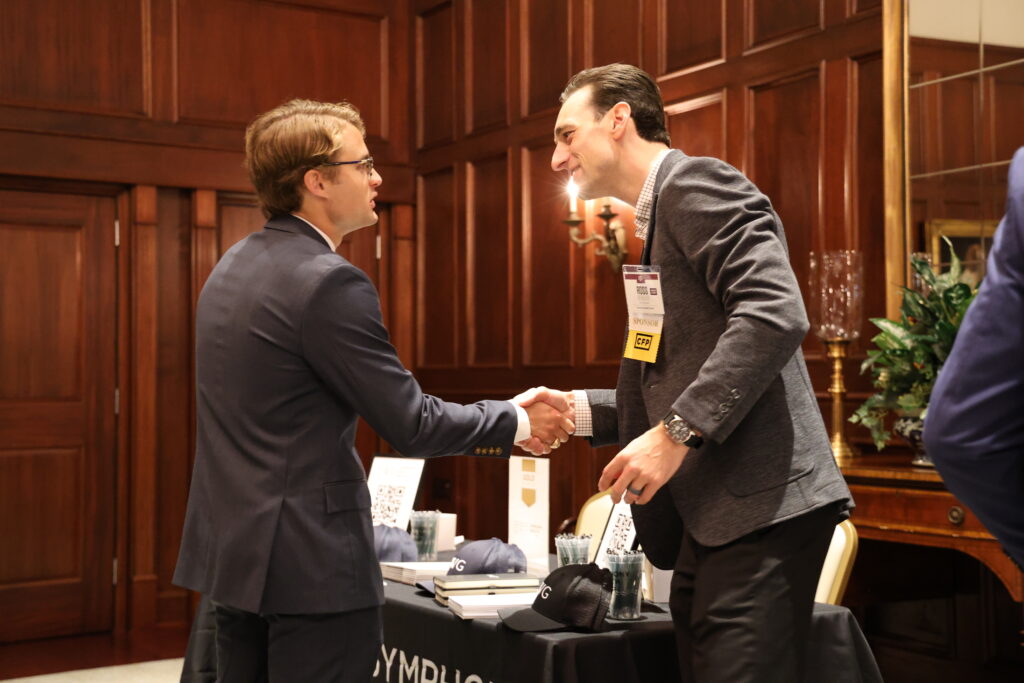 Conference attendees hake hands